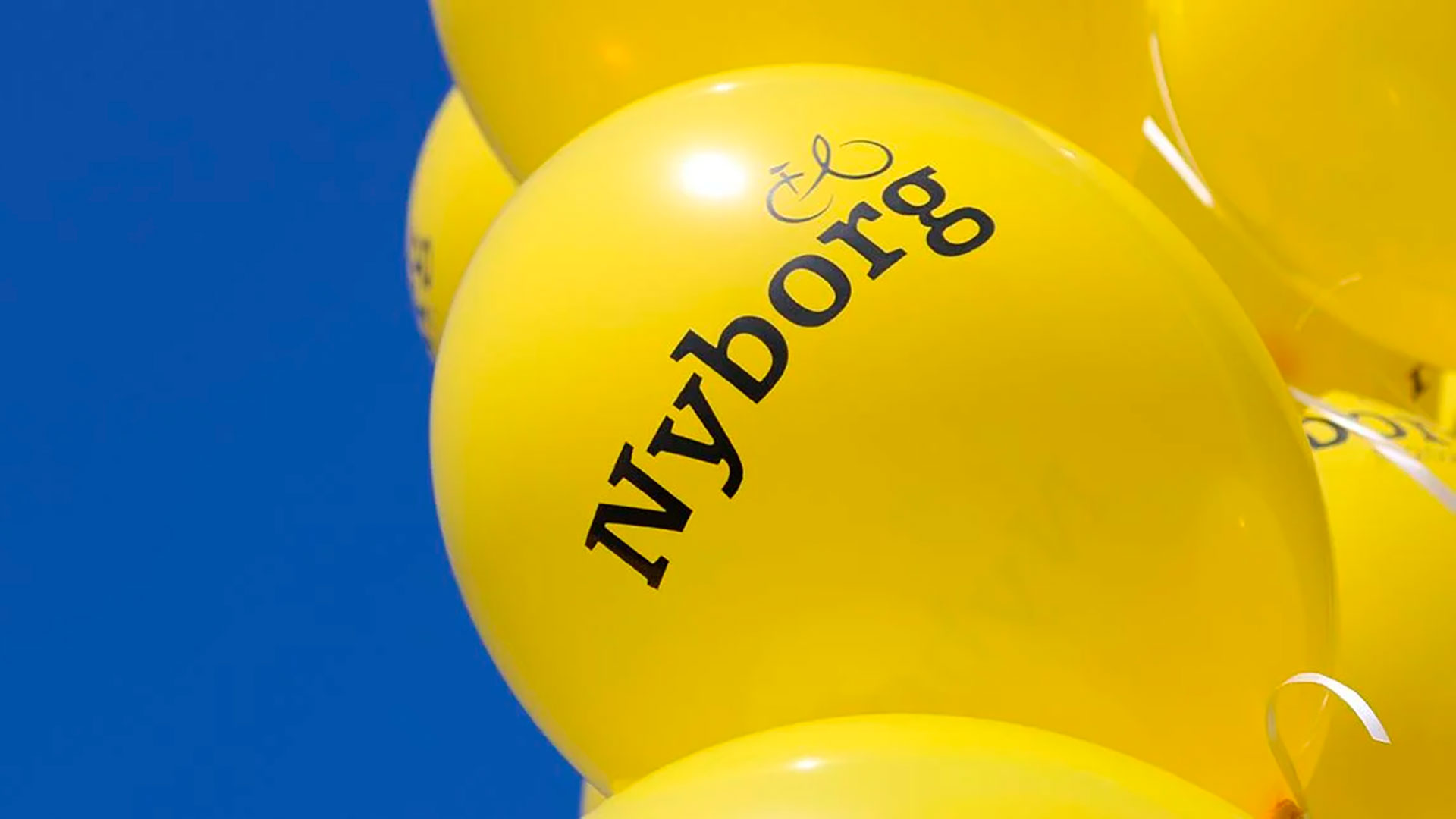 Gule 'Vi mødes om touren' balloner